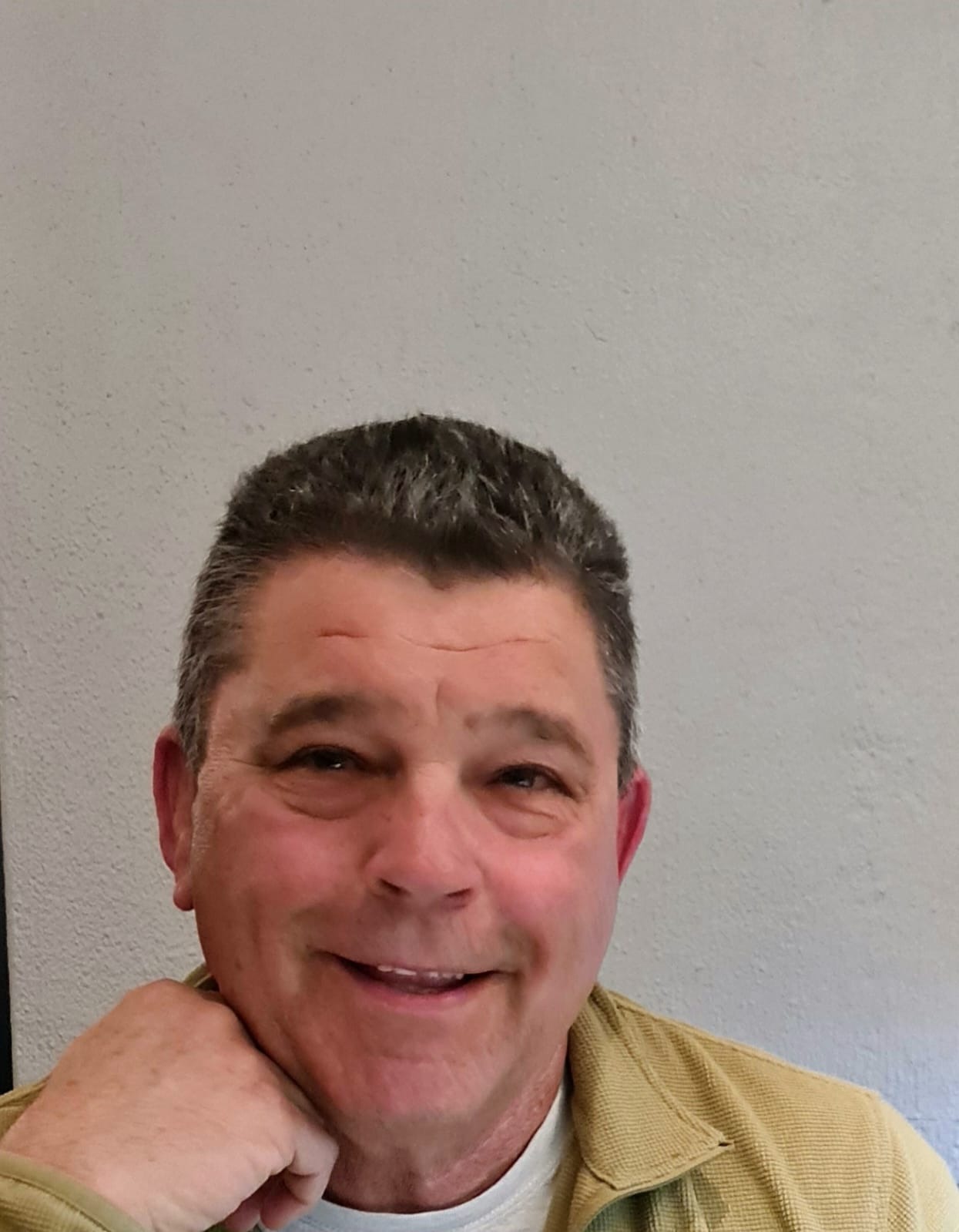 Chris, owner of Bruwer Electrical, smiling at the camera